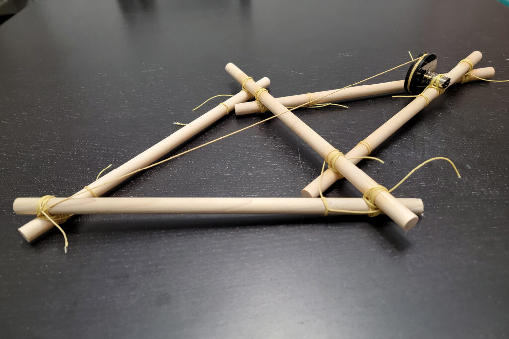 Prototype of Devin Carroll’s orthosis robot. “Here I used dowels as a proof of concept, but it’s possible to use just tree branches and strings,” says Carroll. (Image: Devin Carroll)